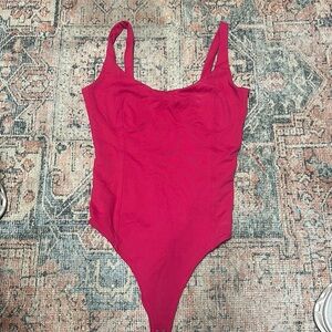 Pink bodysuit